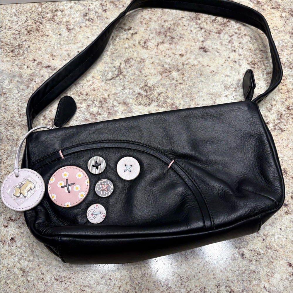 Radley London bag with cute button accents 
Hang Tag
Original dust cover